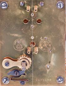 German 400-Day or Anniversary clock: (Retailer =Kuehl Clock Company, Chicago), time only spring driven movement torsion pendulum movement by Gustav Becker of Freiburg, Germany with disc pendulum in polished brass case under glass dome, c1910.