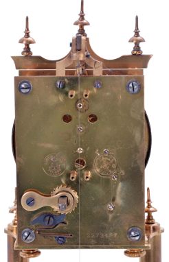 German 400-Day or Anniversary clock: (Retailer =Kuehl Clock Company, Chicago), time only spring driven movement torsion pendulum movement by Gustav Becker of Freiburg, Germany with disc pendulum in polished brass case under glass dome, c1910.
