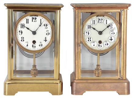 Clocks- 2 (Two) Boston Clock Co., Boston, Mass. Crystal Regulators: (1) 8 day spring driven movement with single arbor winding time and strike brass lever movement, c1900; (2) 8 day spring driven movement with single arbor winding time and strike brass lever movement, c1900.