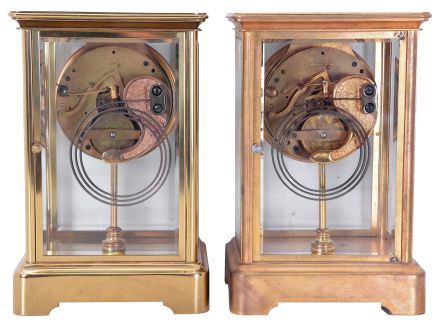 Clocks- 2 (Two) Boston Clock Co., Boston, Mass. Crystal Regulators: (1) 8 day spring driven movement with single arbor winding time and strike brass lever movement, c1900; (2) 8 day spring driven movement with single arbor winding time and strike brass lever movement, c1900.