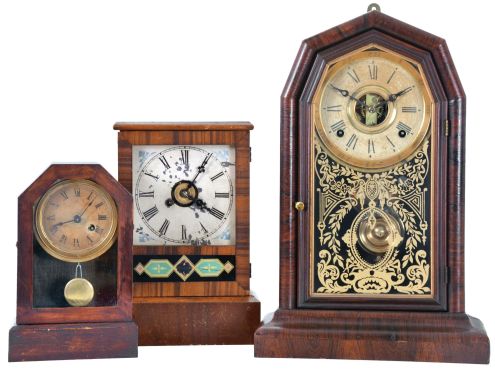 Clocks- 3 (Three): (1) E. N. Welch Mfg. Co., Forestville, Conn., "Empress V.P." shelf clock with a spring driven, 8 day, time and strike movement in a rosewood veneered case, c1880; (2) Unidentified American Cottage clock, probably Waterbury, with a spring driven 30 hour time and alarm movement in a rosewood veneered case, c1870; (3) The Terry Clock Co., Waterbury, Conn., Cottage clock with a spring driven 30 hour timepiece movement in a mahogany veneered case, c1870.