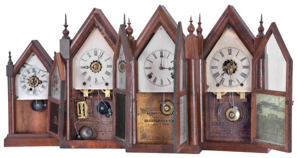 Clocks- 4 (Four): (1) American, Unknow, 30 hour, time and alarm spring driven movement miniature sharp gothic or steeple clock, c1870; (2) New Haven Clock Co., New Haven, Conn., 8 day, time, strike and alarm spring driven movement sharp gothic or steeple clock, c1870; (3) Waterbury Clock Co., Waterbury, Conn., 8 day, time and strike spring driven movement sharp gothic or steeple clock, c1870; (4) Wm. L. Gilbert & Co., Winsted, Conn., 8 day, time and strike spring driven movement sharp gothic or steeple clock, c1860.