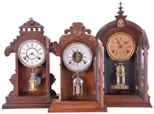 Clocks- 3 (Three): (1) William L. Gilbert Clock Co., Winsted, Conn., "Lebanon" shelf clock with a spring driven, 8 day, time and strike movement in a walnut case, c1885; (2) Ansonia Clock Co., New York, NY, "Parisian" shelf clock with a spring driven, 8 day time and half hour strike movement in a black walnut case, c1880; (3) William L. Gilbert Clock Co., Winsted, Conn., unidentified shelf model with a spring driven, 8 day, time and strike movement with a simple calendar mechanism in a walnut case, c1885.