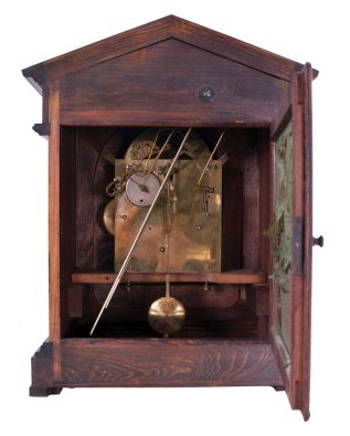Junghans, Germany, 8 day spring driven movement, three train Westminster chime bracket clock with A13 movement in an architectural style mahogany case. The clock chimes the quarters on 4 rods. The hour is struck on a fifth deeper toned rod, c1900.
