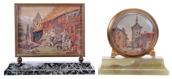 Didisheim, Goldschmidt, Fils & Co., Switzerland- 2 (Two) 30 hour desk timepieces: (1) the first marked "Idylle au Village" and features a European scene, and with an automated Cupid forging arrows below the clock tower, mounted to a green, variegated marble base, (2) the other with European streetscape, featuring buildings and a clock tower, and mounted to a green onyx base, dimensions of first clock listed