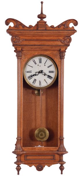 Waterbury Clock Co., Waterbury, Conn., "Kendall" wall hanging clock with a spring driven, 8 day time and half hour strike (cathedral gong) movement in an oak case.