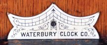 Waterbury Clock Co., Waterbury, Conn., "Kendall" wall hanging clock with a spring driven, 8 day time and half hour strike (cathedral gong) movement in an oak case.