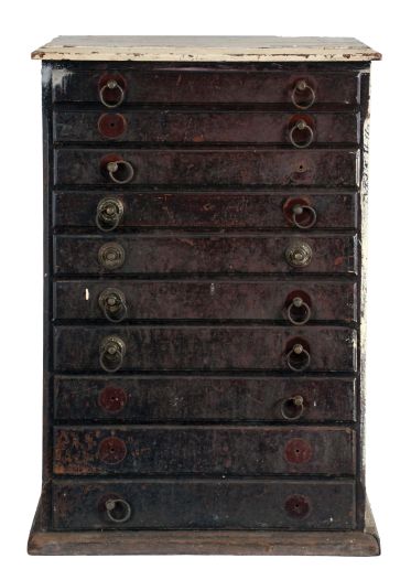 Watchmakers crystal cabinet with contents, walnut, ten drawer cabinet with nickel plated pulls, with a substantial inventory of glass pocket watch crystals, one drawer empty