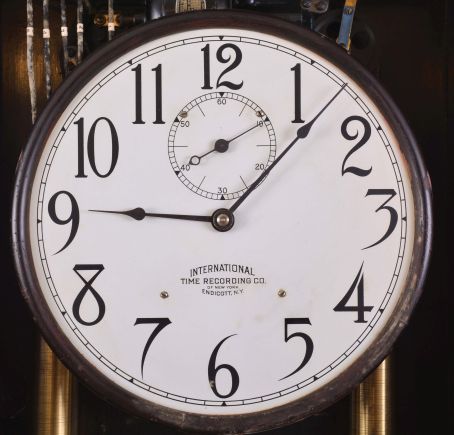 International Time Recording Co., Endicott, New York, "Model No. 16-2" wall hanging master clock, 8 day, time only, weight driven movement with two jar mercury pendulum, in a dark finished wooden case with painted metal dial, serial #425576