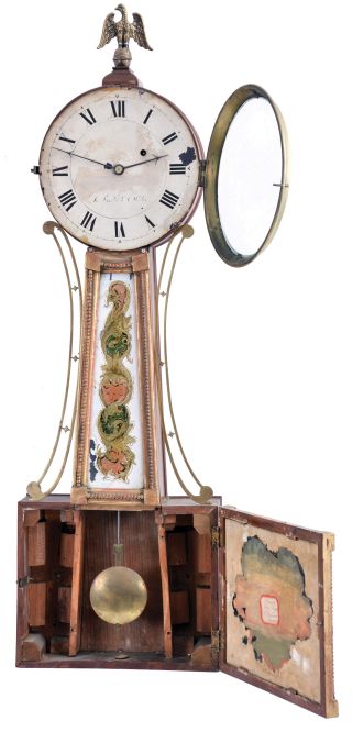 New Hampshire, 8 day, weight driven, brass movement Patent or banjo timepiece. The signature on the dial is difficult to read, but it appears to read in part Smith & Willis. There was a Smith & Williston in Keene, New Hampshire who advertised as clockmakers, that may be the firm name.