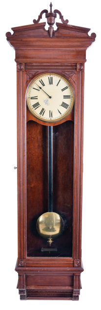 New York Standard Watch Co., Jersey City, New Jersey, electric hanging regulator, walnut case with molded door and base, Roman numeral painted dial with brass bezel, in line movement with Hipp toggle, pendulum with ebonized wooden rod and heavy brass clad ball