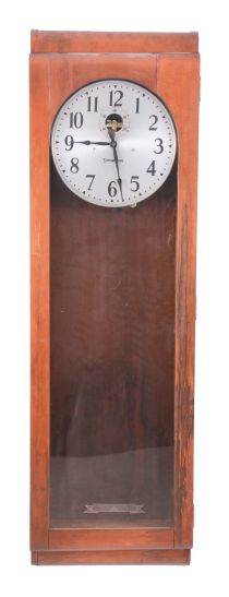 Stromberg Time Corporation, New York, NY, electric master regulator wall clock, time only movement marked "6957M" with deadbeat escapement in a mahogany case with silvered metal dial, patent date 1941
