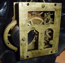 Bradley and Hubbard, Meriden, Conn., "Sambo" blinking eye clock with a spring driven balance wheel timepiece movement (unsigned) in a cast iron case.