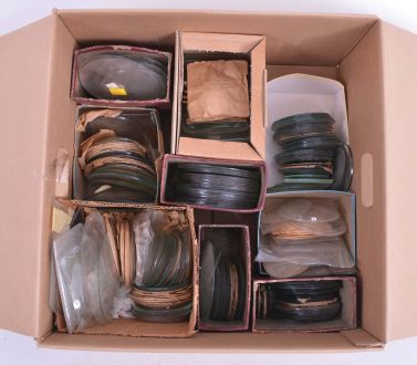 Clock Glasses: Large assortment of hundreds of clock glasses including flat and convex as well as some flat decorated tablets.