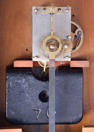 E. Howard & Co., Boston, Mass., "No. 70-16 Regulator", wall clock, oak case with turned wooden bezel and reverse painted tablet, Roman numeral painted dial, blued steel hands, and 8 day, time only, weight driven movement