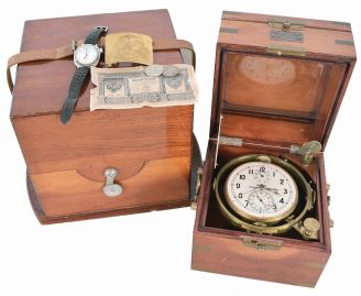 First Moscow Watch Factory, USSR, two day marine chronometer, 15 jewel, damascened, gilt movement with fusee, break circuit mechanism, and integral balance with helical hairspring, Arabic numeral silvered dial with gilt spade and poker hands, mounted in a gimbaled bowl and contained in a brass mounted mahogany box, and with outer, lined protective mahogany box, serial #11577, together with a Soviet era boxed wristwatch, and more, 20th century