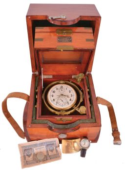 First Moscow Watch Factory, USSR, two day marine chronometer, 15 jewel, damascened, gilt movement with fusee, break circuit mechanism, and integral balance with helical hairspring, Arabic numeral silvered dial with gilt spade and poker hands, mounted in a gimbaled bowl and contained in a brass mounted mahogany box, and with outer, lined protective mahogany box, serial #11577, together with a Soviet era boxed wristwatch, and more, 20th century