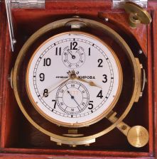 First Moscow Watch Factory, USSR, two day marine chronometer, 15 jewel, damascened, gilt movement with fusee, break circuit mechanism, and integral balance with helical hairspring, Arabic numeral silvered dial with gilt spade and poker hands, mounted in a gimbaled bowl and contained in a brass mounted mahogany box, and with outer, lined protective mahogany box, serial #11577, together with a Soviet era boxed wristwatch, and more, 20th century