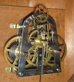 E. N. Welch Mfg. Co., Forestville, Conn., "Alexis No. 1" wall hanging clock with a spring driven 30 day time only movement in a rosewood veneered case with faux grained bezels.