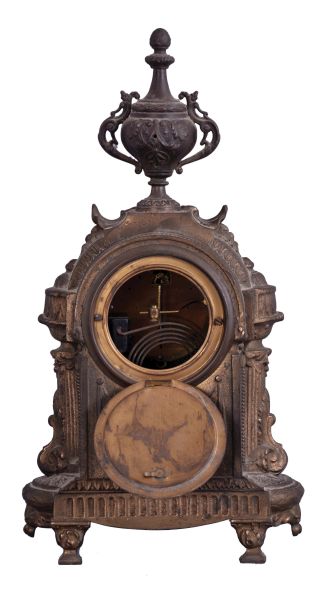 Clocks- 2 (Two): (1) Ansonia Clock Co., New York, NY, "Versailles" mantel clock with a spring driven, 8 day time and half hour strike movement in a cast metal case, c1914. ; (2) New Haven Clock Co., New Haven, Conn., "Winnipeg" hanging clock with a spring driven, 8 day timepiece movement in a walnut case, c1885.