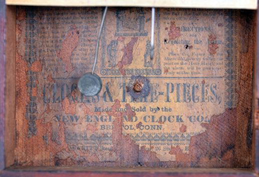 New England Clock Co., Bristol conn. 30 hour, time and alarm spring driven movement cigar box timepiece.
