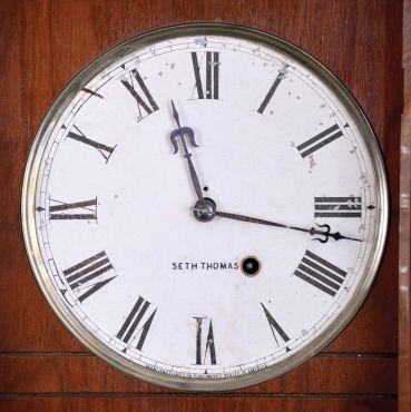 Seth Thomas Clock Co., Thomaston, Conn., "Queen Anne" hanging clock with a spring driven, 8 day timepiece movement in a walnut case.