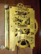 Seth Thomas Clock Co., Thomaston, Conn., "Queen Anne" hanging clock with a spring driven, 8 day timepiece movement in a walnut case.