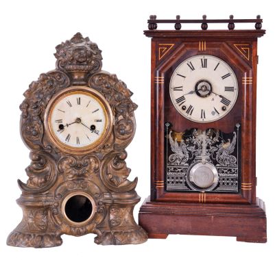 Clocks- 2 (Two): (1) Seth Thomas Clock Co., Thomaston, Conn., "Omaha", 8 day, time and strike spring driven movement city series shelf clock, c1887; (2) American Clock Co., New York, New York, 30 hour, time and strike spring driven movement iron front shelf clock, c1850