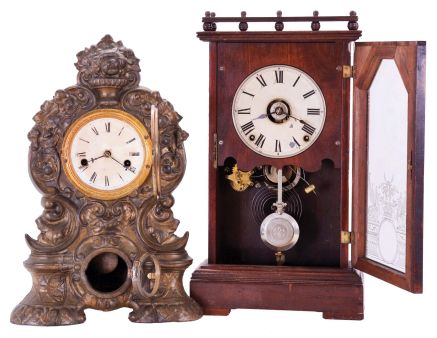 Clocks- 2 (Two): (1) Seth Thomas Clock Co., Thomaston, Conn., "Omaha", 8 day, time and strike spring driven movement city series shelf clock, c1887; (2) American Clock Co., New York, New York, 30 hour, time and strike spring driven movement iron front shelf clock, c1850
