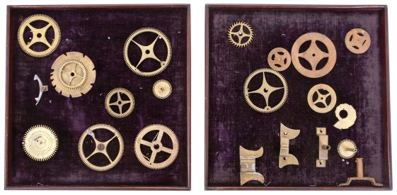 Trays, Art, and Ephemera- 42 (Forty-two) watch and jewelry trays, most wood with velvet lining in various sizes; Engraving titled "Departure for the War" featuring a domestic scene with a clock in the background. The drawing is by G. White and the engraving by J.C. McRae; 2 (Two) framed color prints by Helena Maguire. One features a capercailzie (Norethern European grouse) and pigeons. The other features a hare and French partridges; 2 (Two) framed sets of tall clock parts showing various states of manufacture; 24 (Twenty-four) watch and clock related packages including boxes for dollar watches, mainsprings, desk clocks, and wrist watches.