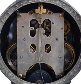 Ansonia Clock Co., New York, NY, "Violinist" shelf clock with a spring driven, 8 day time and half hour strike movement with visible escapement in a cast metal and enameled iron case.