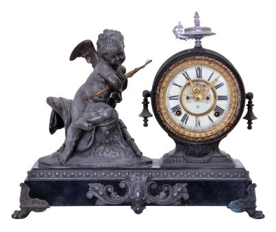 Ansonia Clock Co., New York, NY, "Cupid" figural mantel clock with an 8 day spring driven time and half hour strike movement with visible escapement in a cast metal case.