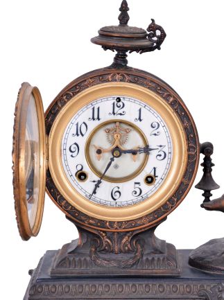 Ansonia Clock Co., New York, NY, "Eros" figure mantel clock with an 8 day spring driven time and half hour strike movement in a cast metal case with bronze plating.