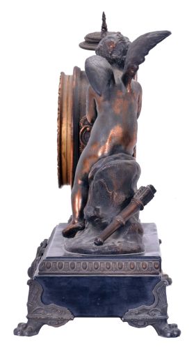 Ansonia Clock Co., New York, NY, "Eros" figure mantel clock with an 8 day spring driven time and half hour strike movement in a cast metal case with bronze plating.