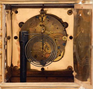 Ansonia Clock Co., New York, NY, "The Regent" mantel clock with matching candelabra, fancy cast case with gilt finish, Arabic numeral white enamel dial, 8 day, time and strike movement