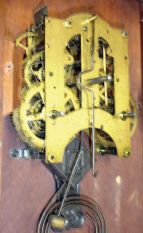Ansonia Clock Co., New York, NY, "Monarch" shelf clock with a spring driven, 8 day time and half hour strike movement in a black walnut case.