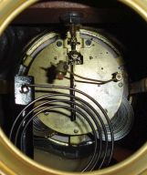 Ansonia Clock Co., New York, NY, "Superba base with La Source top ornament" figural shelf clock with a spring driven, 8 day, time and strike movement in a cast metal case with Brazilian onyx inlay panels.