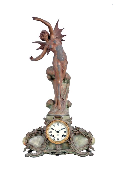 Ansonia Clock Co., New York, NY, "Superba base with La Vague top ornament" figural shelf clock with a spring driven, 8 day, time and strike movement in a cast metal case with Brazilian onyx panel inserts.