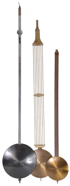 Clock parts- (1) One modern tall clock case in oak; (2) 8 day weight driven 5-tube chime tall clock movement by Jauch; (3) Electrically driven 5-tube chiming tall clock movement by Revere Clock Co. of Cincinnati, OH with Telechrone synchronous motor and dial; (4) 6 sets of tubular chimes: one set of four, one set of seven, and four sets of five; (5) three tall clock pendulums.