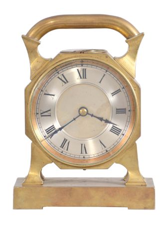 France, desk clock, 8 day timepiece with balance wheel movement and directional compass on a brass base supporting an octagonal case on four feet, topped with a handle, c1900.