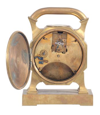 France, desk clock, 8 day timepiece with balance wheel movement and directional compass on a brass base supporting an octagonal case on four feet, topped with a handle, c1900.