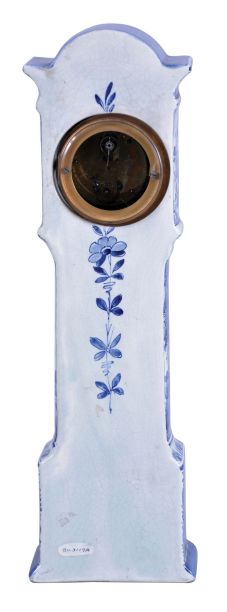 France, ceramic miniature tall clock, the earthenware case with blue, freehand decoration on a white ground, depicting harbor scenes with windmills on the trunk and base, with naturalistic ornament on the bonnet and base sides, Roman numeral white enamel dial with gilt Louis XV style hands, 8 day timepiece movement with cylinder platform, case bottom with makers mark