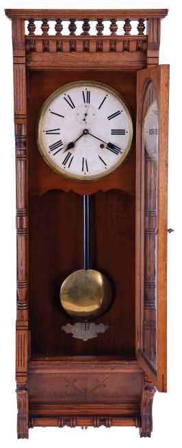 Ansonia Clock Co., New York, NY, "Santa Fe" hanging clock with a spring driven, 8 day time and half hour strike (cathedral gong) in an oak case.