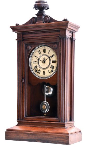 Seth Thomas Clock Co., Thomaston, Conn., "Greek" shelf clock with a spring driven, 8 day, time and strike, lyre movement in a walnut case.