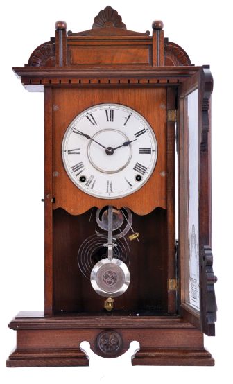 Seth Thomas Clock Co., Thomaston, Conn., "Ogden" shelf clock with a spring driven, 8 day, time and strike, lyre movement in a walnut case.