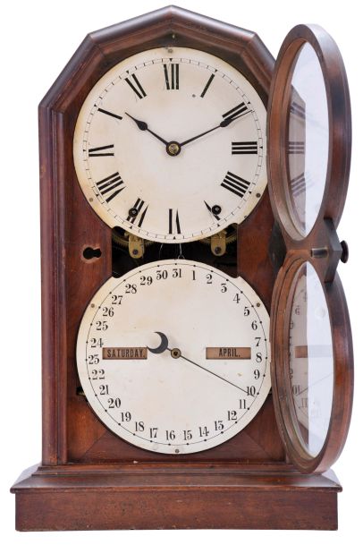 Seth Thomas Clock Co., Thomaston, Conn., "Parlor Calendar No. 5" shelf clock with a spring driven, 8 day, time and strike movement with the R. T. Andrews patented perpetual calendar mechanism in a polished walnut veneered case.
