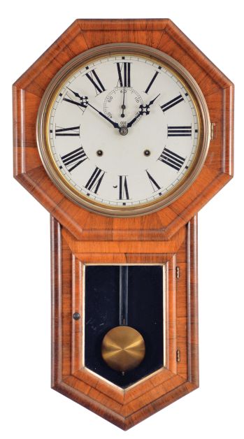E. N. Welch Mfg. Co., Forestville, Conn., "Verdi" hanging clock with a spring driven, 8 day, time and strike movement is a rosewood veneered case.
