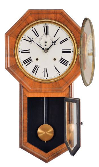 E. N. Welch Mfg. Co., Forestville, Conn., "Verdi" hanging clock with a spring driven, 8 day, time and strike movement is a rosewood veneered case.