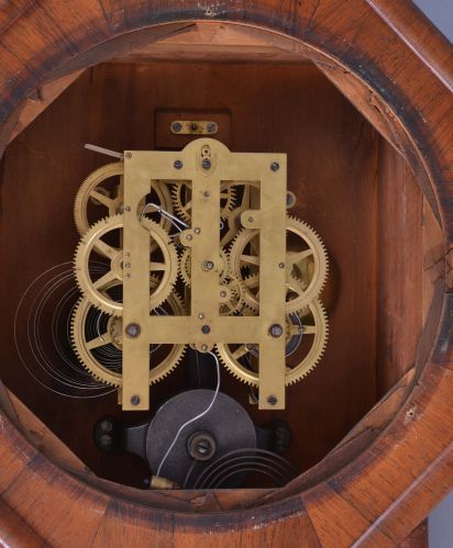 E. N. Welch Mfg. Co., Forestville, Conn., "Verdi" hanging clock with a spring driven, 8 day, time and strike movement is a rosewood veneered case.
