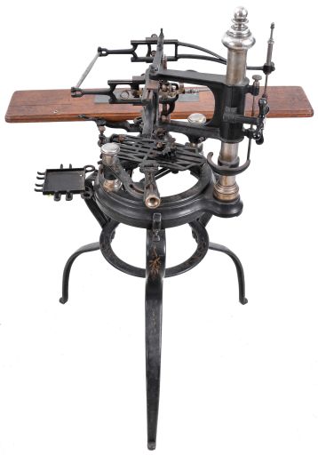 Francis Engraving Co., pantograph engraving machine, japanned cast iron frame and base with painted decoration, nickel plated columns supporting the pantograph and work holder, oak clamping shelf for templates, with a large number of zinc letter and number templates in various fonts
